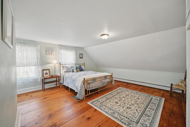 30 Pine St, Thomaston, ME 04861 - bedroom featuring lofted ceiling, hardwood / wood-style floors, and a baseboard heating unit