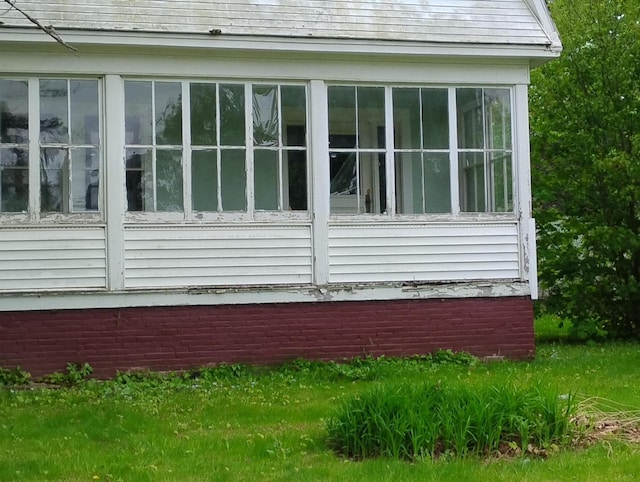 105 Broadway, Baileyville, ME 04694 - view of side of property with a sunroom