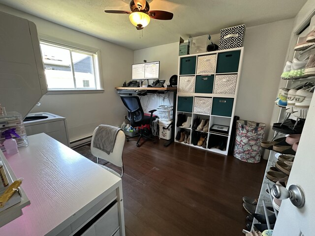 office area with dark wood-style flooring, ceiling fan, and a baseboard radiator