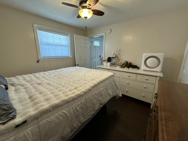 bedroom featuring dark wood-style floors and ceiling fan