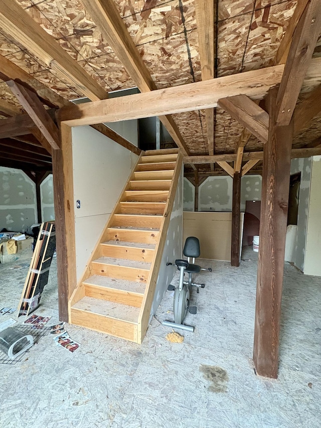 basement featuring stairs
