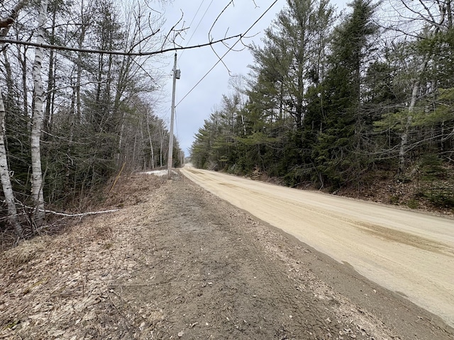 view of road with a view of trees