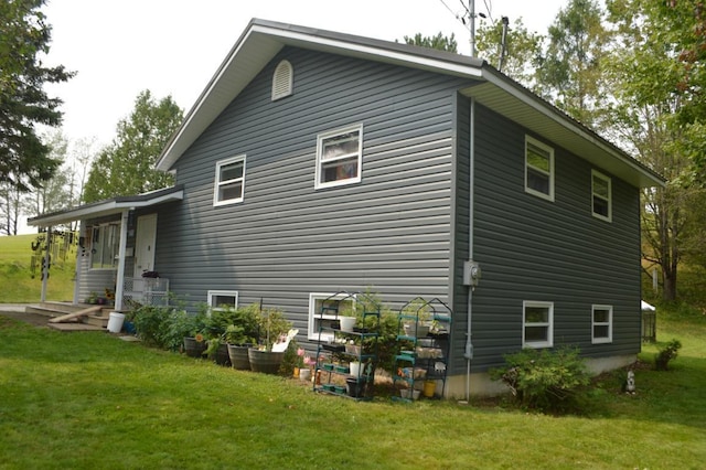 view of property exterior featuring a yard