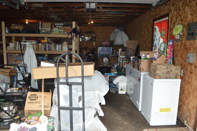 garage featuring refrigerator and electric panel