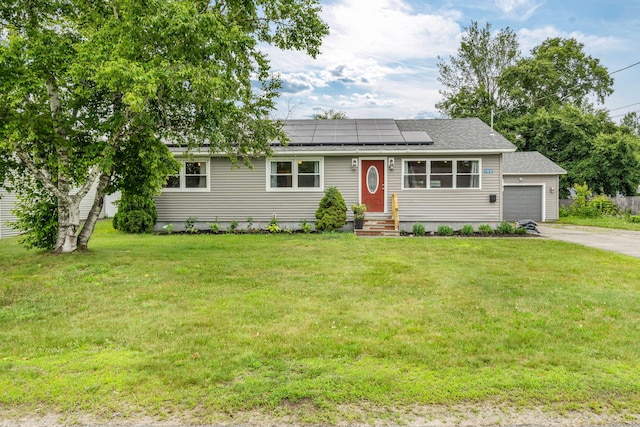 102 New Hampshire St, Millinocket, ME 04462 - ranch-style house featuring driveway, roof mounted solar panels, a front yard, a garage, and a shingled roof