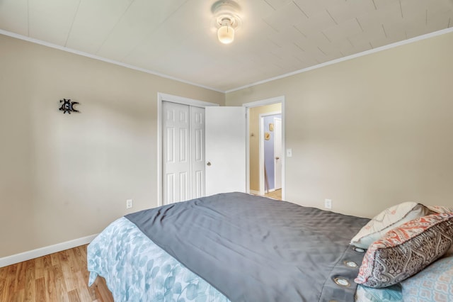 102 New Hampshire St, Millinocket, ME 04462 - bedroom featuring ornamental molding, wood finished floors, and a closet