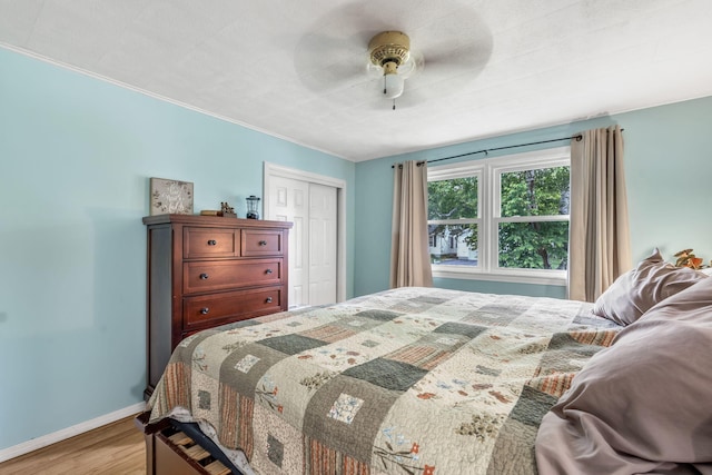102 New Hampshire St, Millinocket, ME 04462 - bedroom featuring wood finished floors, a closet, a ceiling fan, and crown molding