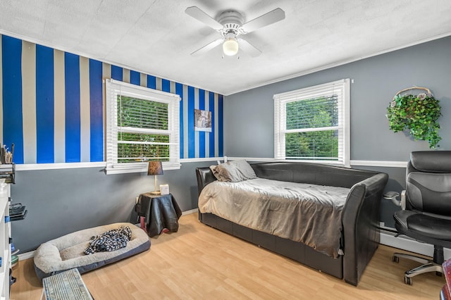 102 New Hampshire St, Millinocket, ME 04462 - bedroom featuring ornamental molding, wood finished floors, wallpapered walls, and ceiling fan