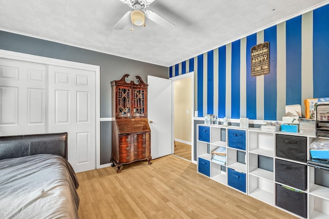 102 New Hampshire St, Millinocket, ME 04462 - bedroom featuring wood finished floors, a closet, a ceiling fan, and crown molding