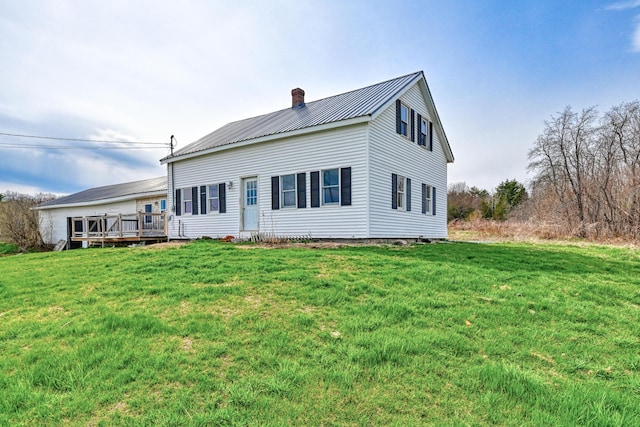 93 Pond Rd, Albion, ME 04910 - rear view of property featuring a lawn, a chimney, metal roof, and a wooden deck