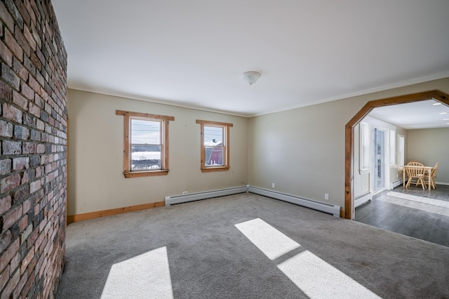 93 Pond Rd, Albion, ME 04910 - carpeted empty room featuring baseboards, arched walkways, a baseboard heating unit, and ornamental molding