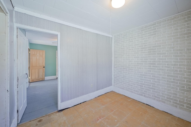 93 Pond Rd, Albion, ME 04910 - spare room with brick wall and baseboards