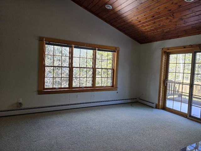 empty room with vaulted ceiling, carpet, a healthy amount of sunlight, and baseboard heating