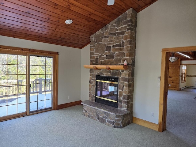 unfurnished living room with wood ceiling, carpet, a stone fireplace, baseboards, and high vaulted ceiling