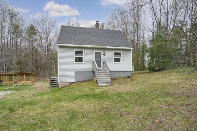 155 Saco Rd, Hollis, ME 04042 - rear view of property featuring a chimney, a lawn, and a shingled roof