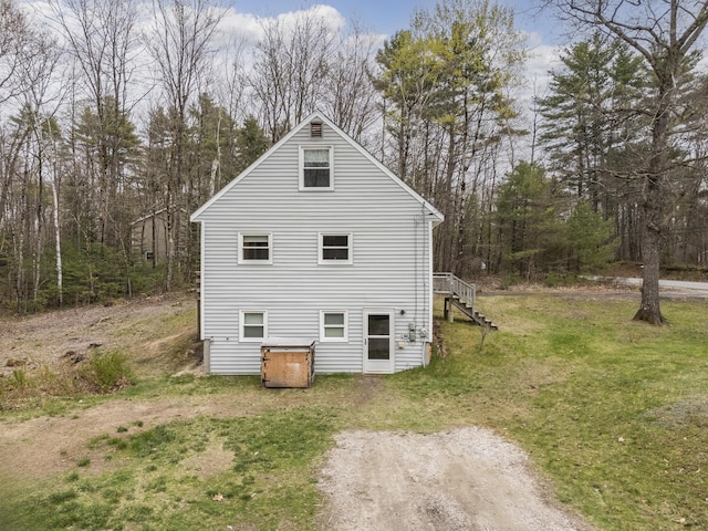 155 Saco Rd, Hollis, ME 04042 - view of home's exterior featuring stairway and a lawn