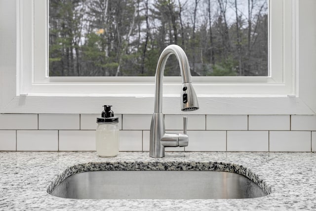 155 Saco Rd, Hollis, ME 04042 - kitchen view of a sink, backsplash, and light stone countertops