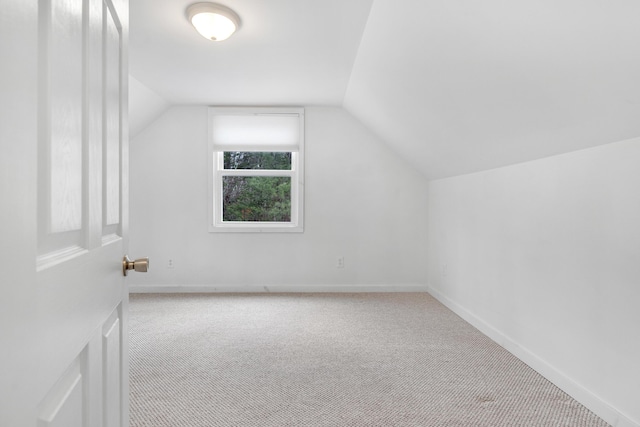 155 Saco Rd, Hollis, ME 04042 - additional living space with carpet floors, vaulted ceiling, and baseboards