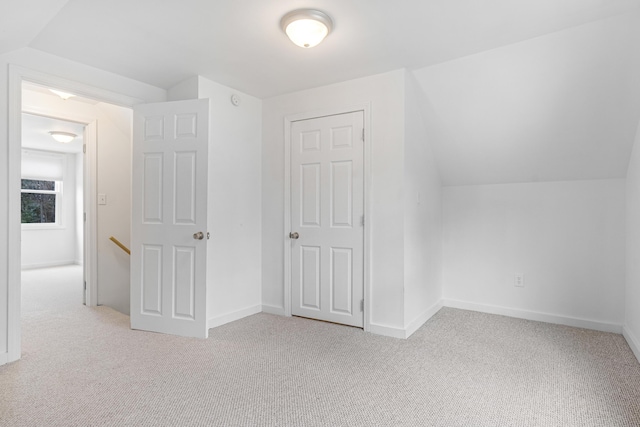 155 Saco Rd, Hollis, ME 04042 - unfurnished bedroom with carpet floors, vaulted ceiling, and baseboards