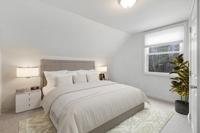 155 Saco Rd, Hollis, ME 04042 - bedroom featuring light colored carpet, vaulted ceiling, and baseboards