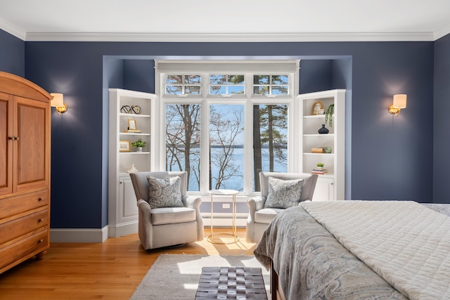bedroom with crown molding, a baseboard radiator, a water view, baseboards, and light wood-type flooring