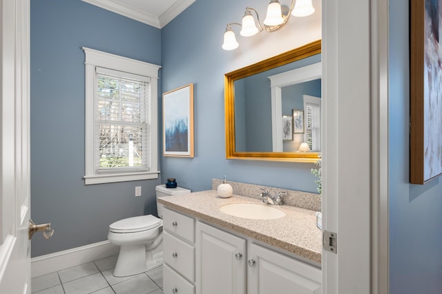 bathroom with vanity, tile patterned floors, toilet, baseboards, and ornamental molding