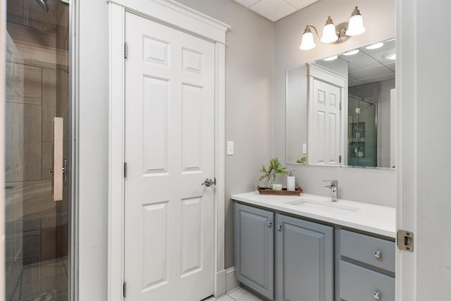 bathroom featuring vanity and a shower with door