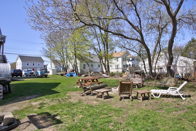 view of yard featuring a residential view and fence