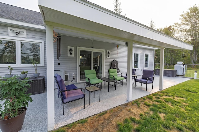 view of patio / terrace with fence and an outdoor hangout area