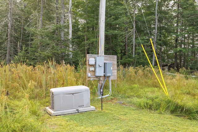 details featuring a power unit and a forest view