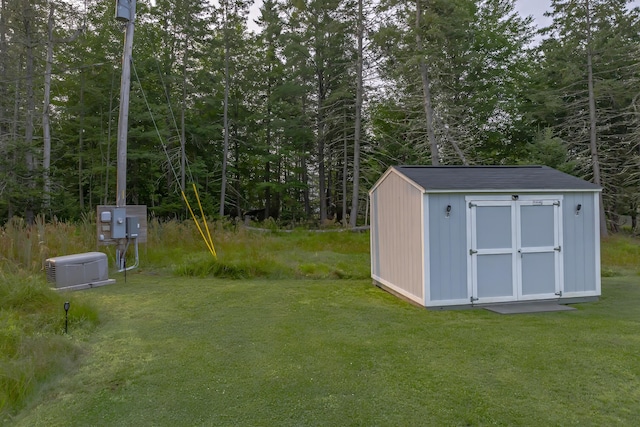 view of shed featuring a wooded view