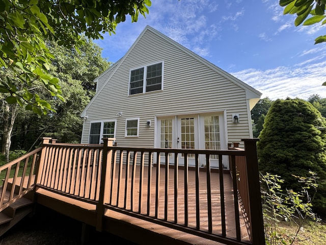back of house with a deck and french doors