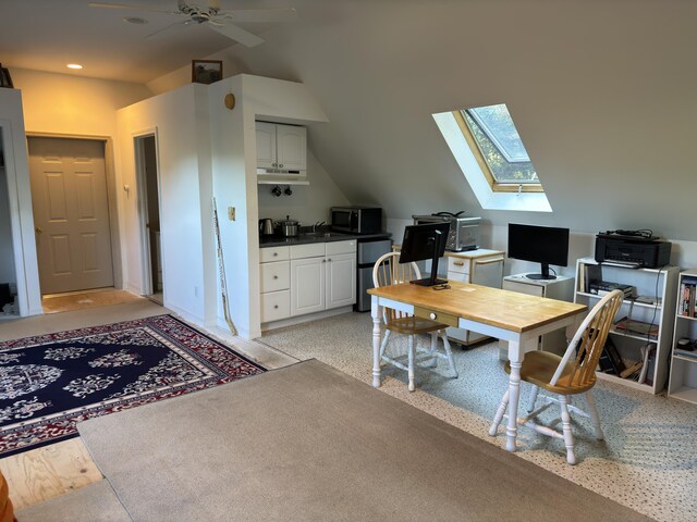 office with lofted ceiling with skylight, recessed lighting, a sink, and ceiling fan