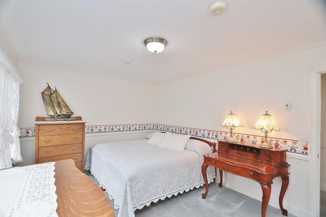 2101 Ohio St, Bangor, ME 04401 - carpeted bedroom featuring crown molding