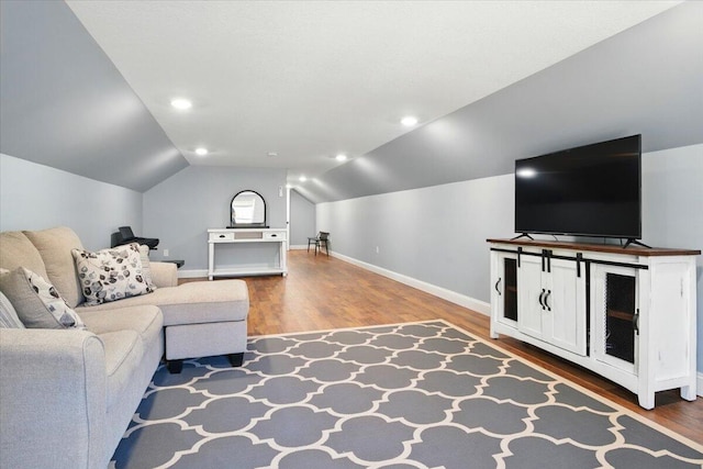 living room with recessed lighting, baseboards, vaulted ceiling, and wood finished floors