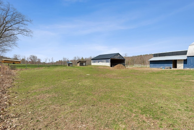 205 Patterson Rd, Limerick, ME 04048 - view of yard featuring fence, a pole building, and an outbuilding