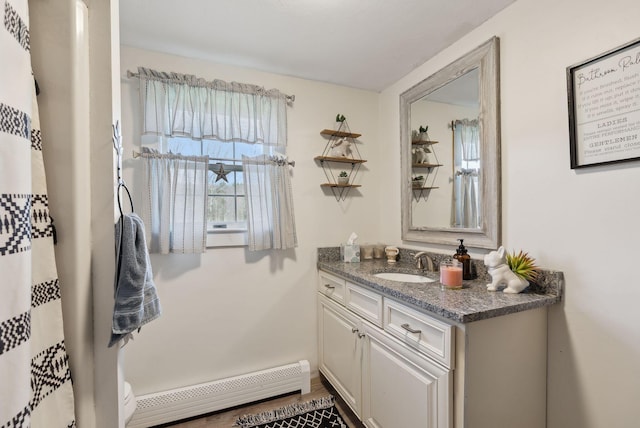 205 Patterson Rd, Limerick, ME 04048 - full bathroom featuring toilet, baseboard heating, and vanity