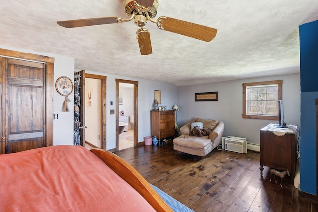 205 Patterson Rd, Limerick, ME 04048 - bedroom with a textured ceiling, ceiling fan, baseboard heating, and hardwood / wood-style floors