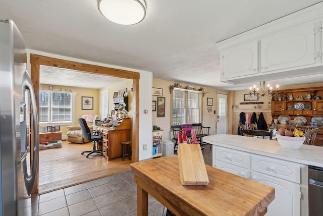 205 Patterson Rd, Limerick, ME 04048 - kitchen featuring light countertops, open floor plan, white cabinets, and stainless steel appliances