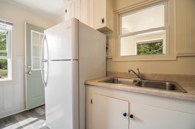 518 Ossipee Trl E, Gorham, ME 04038 - kitchen with a sink, freestanding refrigerator, wood finished floors, light countertops, and ornamental molding