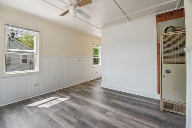 518 Ossipee Trl E, Gorham, ME 04038 - unfurnished room featuring a heating unit, a ceiling fan, wood finished floors, wainscoting, and baseboards
