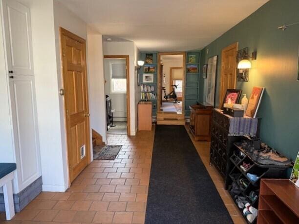 corridor featuring tile patterned flooring