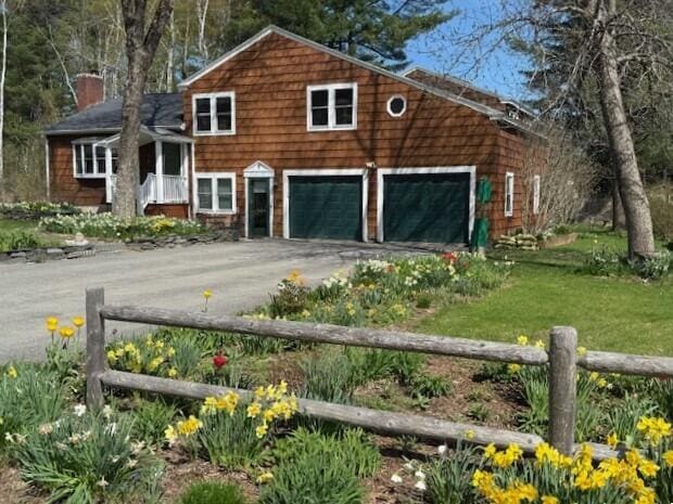 9 Cherry Hill Dr, Waterville, ME 04901 - view of front of house featuring driveway, a chimney, and a front yard