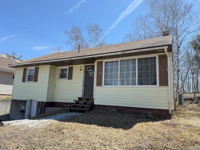 47 New Jersey St, Millinocket, ME 04462 - view of front of home featuring a shingled roof, entry steps, and a chimney
