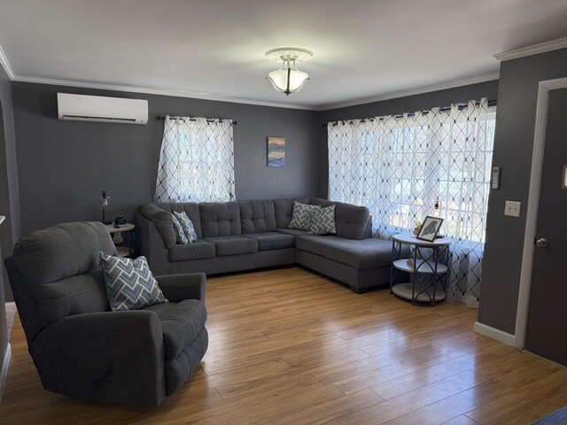 47 New Jersey St, Millinocket, ME 04462 - living area with ornamental molding, wood finished floors, and a wall mounted AC