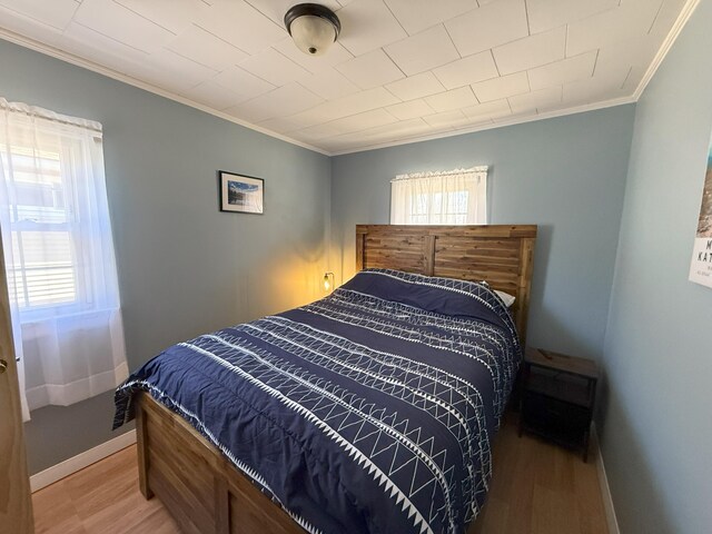 47 New Jersey St, Millinocket, ME 04462 - bedroom featuring baseboards, ornamental molding, and light wood finished floors
