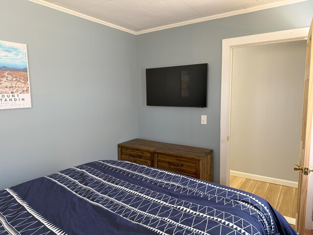 47 New Jersey St, Millinocket, ME 04462 - bedroom with baseboards, wood finished floors, and ornamental molding