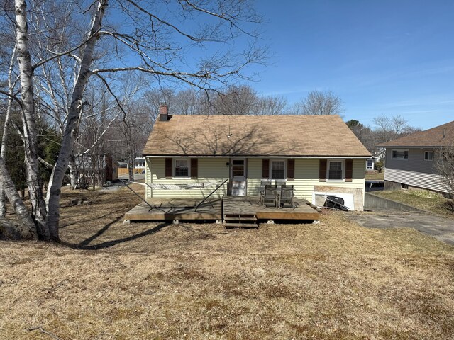 47 New Jersey St, Millinocket, ME 04462 - back of house featuring roof with shingles and a chimney