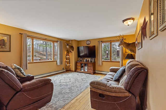living area featuring a baseboard radiator and wood finished floors