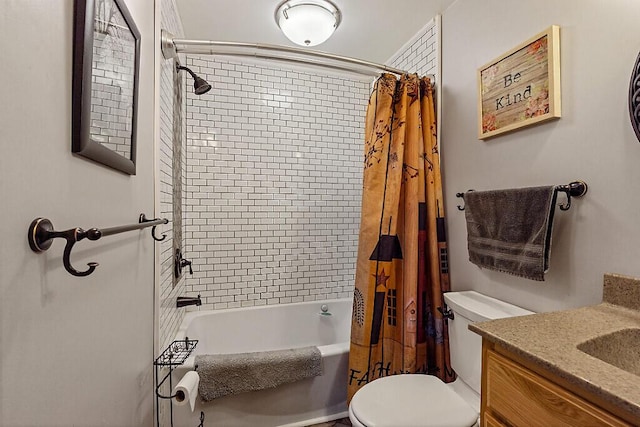 bathroom featuring vanity, shower / bath combo, and toilet